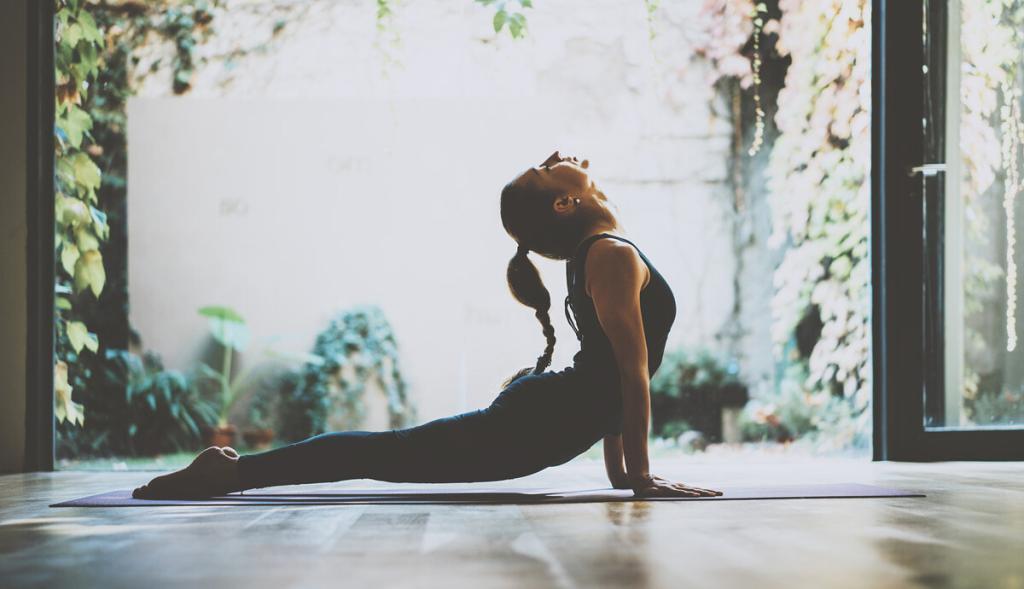 Image of woman doing yoga by an open door