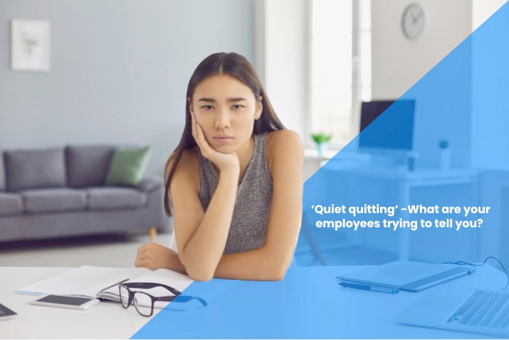 'Quiet quitting - what are your employees trying to tell you?' written over image of young woman at desk looking fed up
