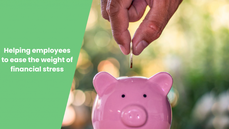 Person dropping coin into a pink piggy bank with blog title 'Helping employees to ease the weight of financial stress'