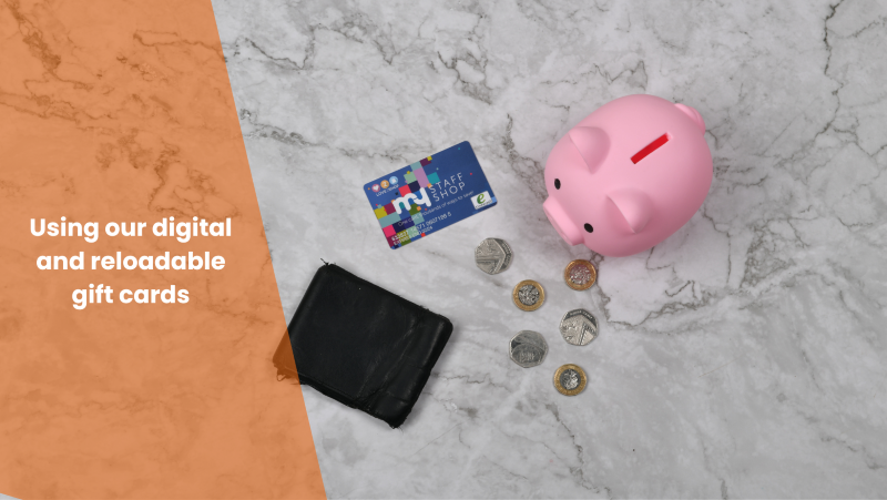 Flatlay displaying pink piggy bank, assorted coins, a black wallet and My Staff Shop gift card with overlay showing blog title, 'Using our digital and reloadable gift cards'