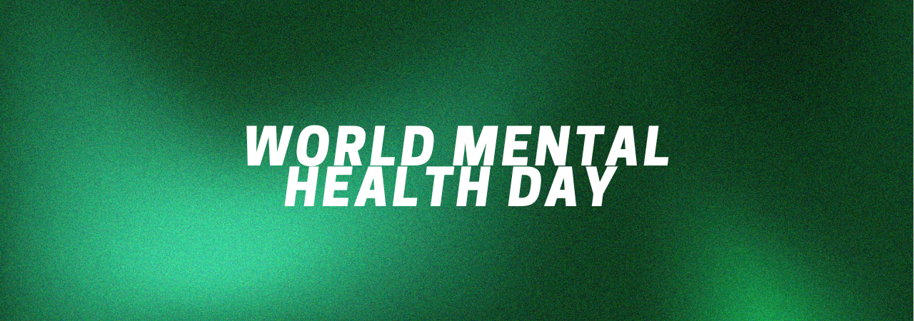 background of fuzzy green hues, with block white font reading 'world mental health day'