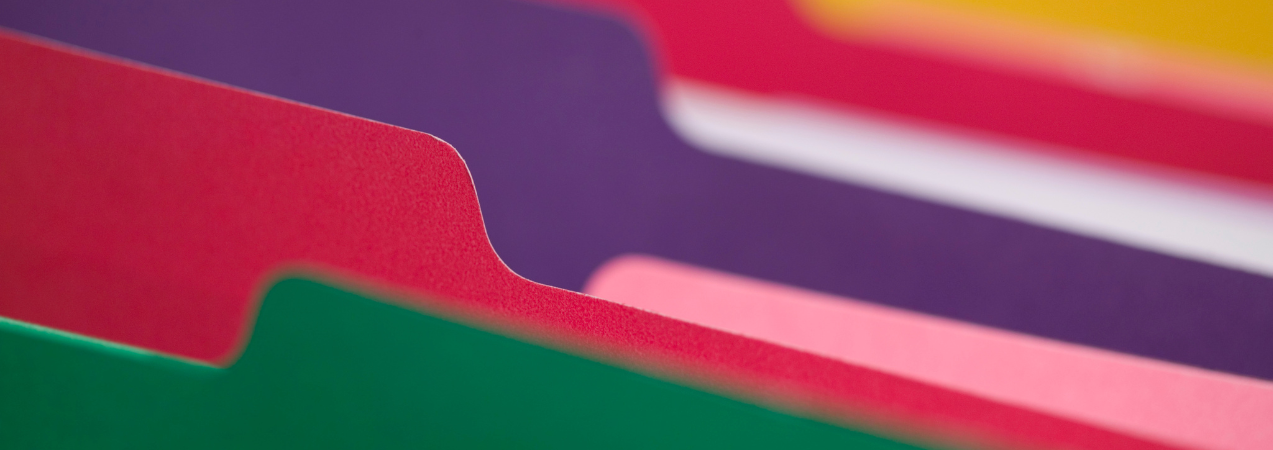 Close up image of colourful folders